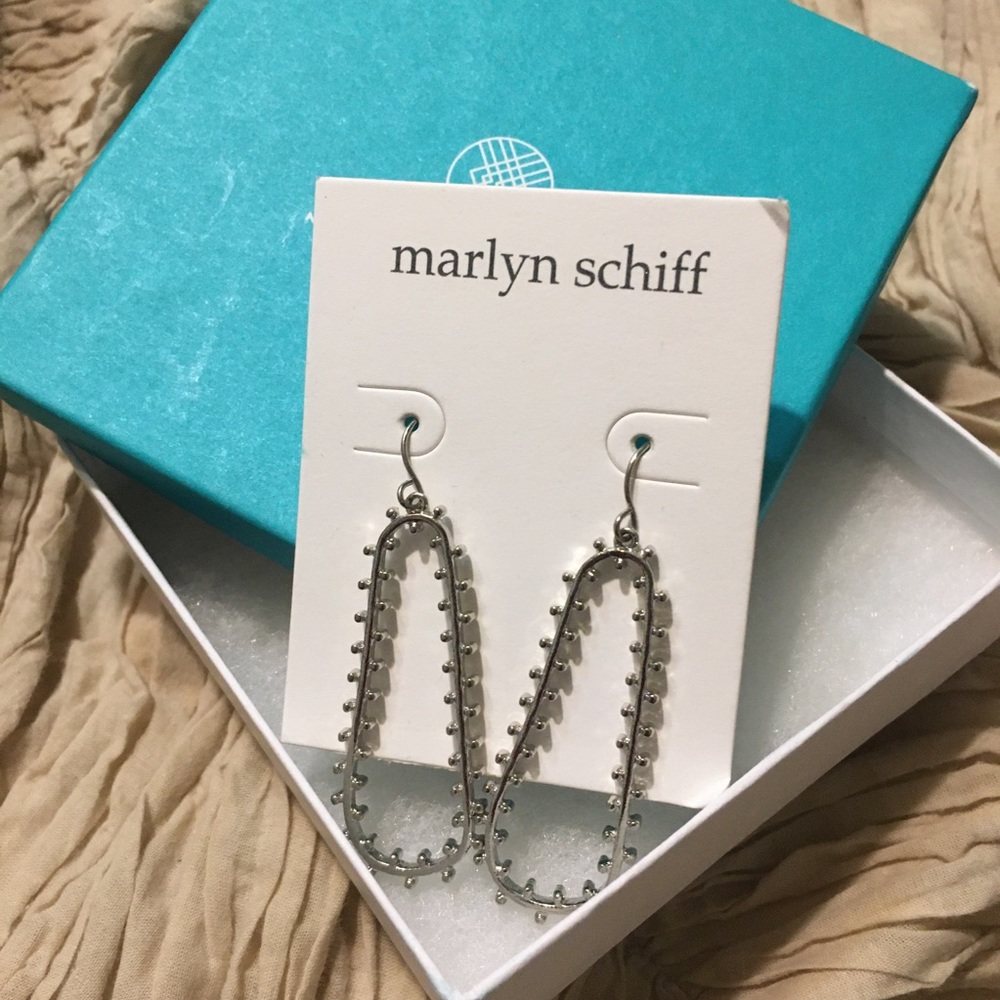 Marlyn Schaffer’s silver dangle earrings.